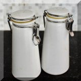K65. Set of 2 white salt and pepper shakers. 5”h - $6 